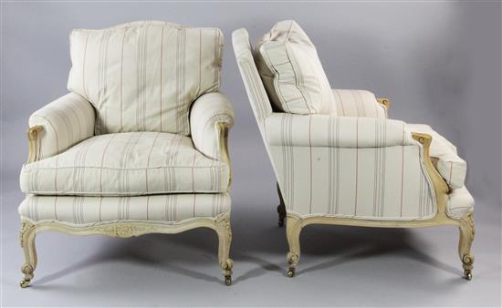 A pair of Louis XV style carved beech upholstered armchairs,